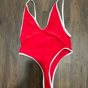 Red one peach bathing suit .